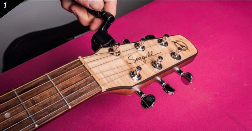 Hoe vervang je de snaren op een akoestische gitaar?